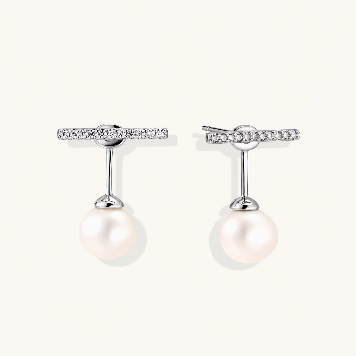Rhodium-plated sterling silver ear jacket earrings with diamond-set horizontal bar and freshwater pearl drop