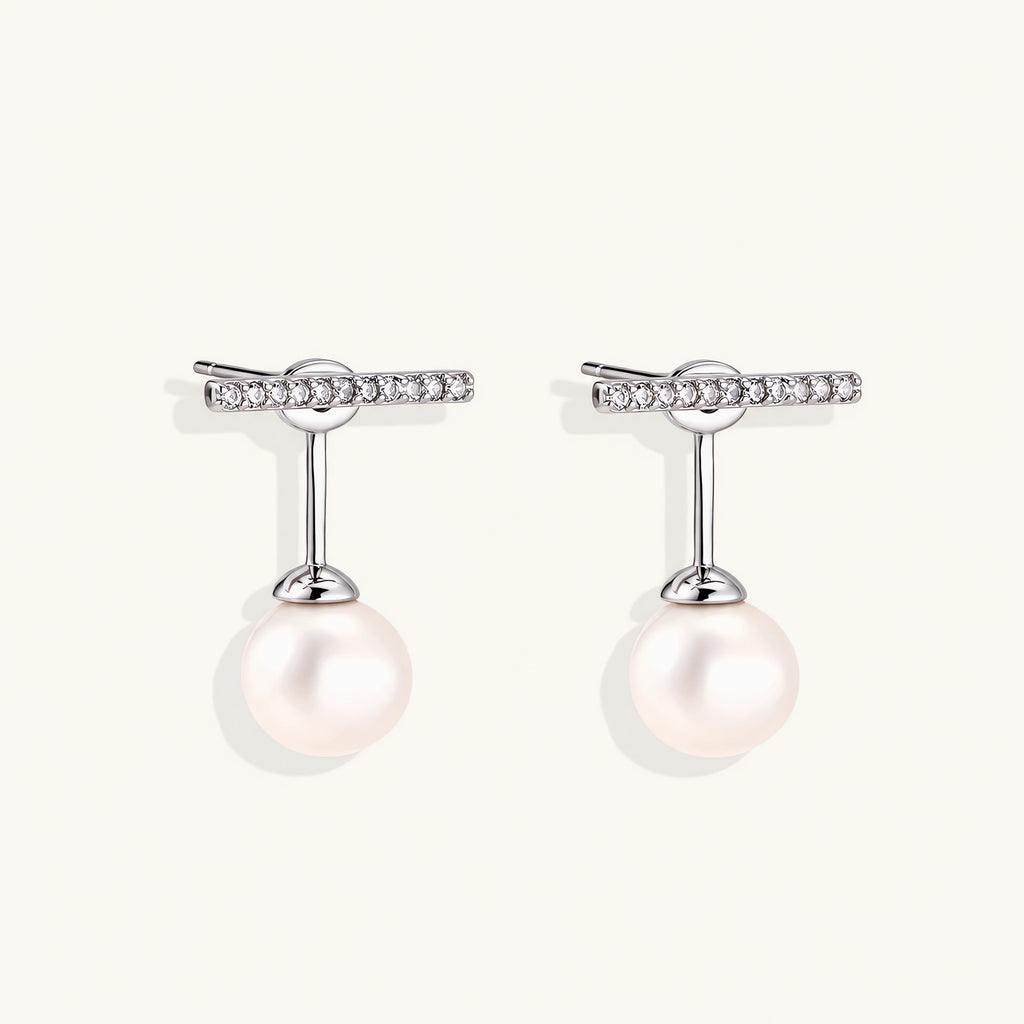 Rhodium-plated sterling silver ear jacket earrings with diamond-set horizontal bar and freshwater pearl drop