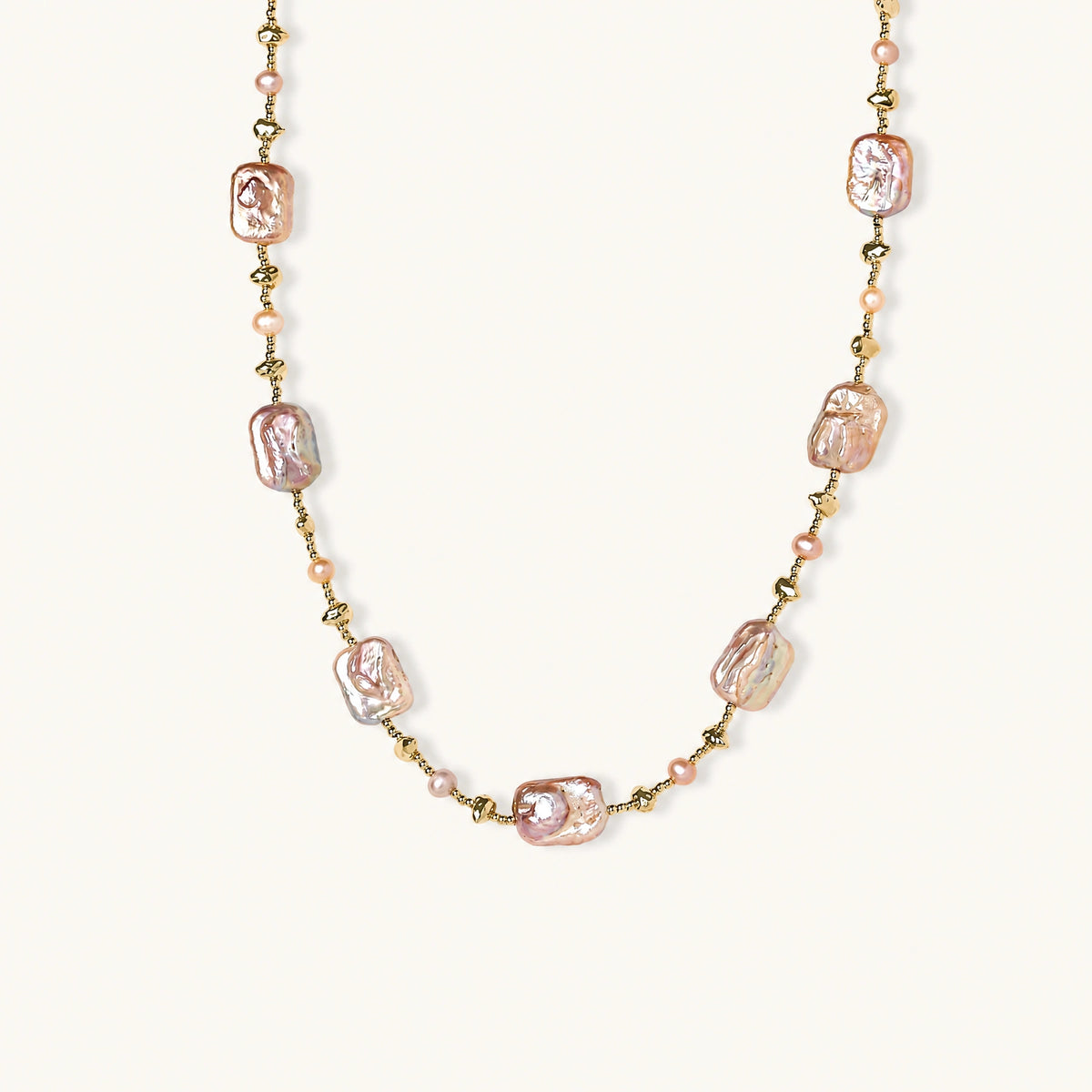 Iridescent baroque pearls alternating with small freshwater pearls on 14K gold-plated chain