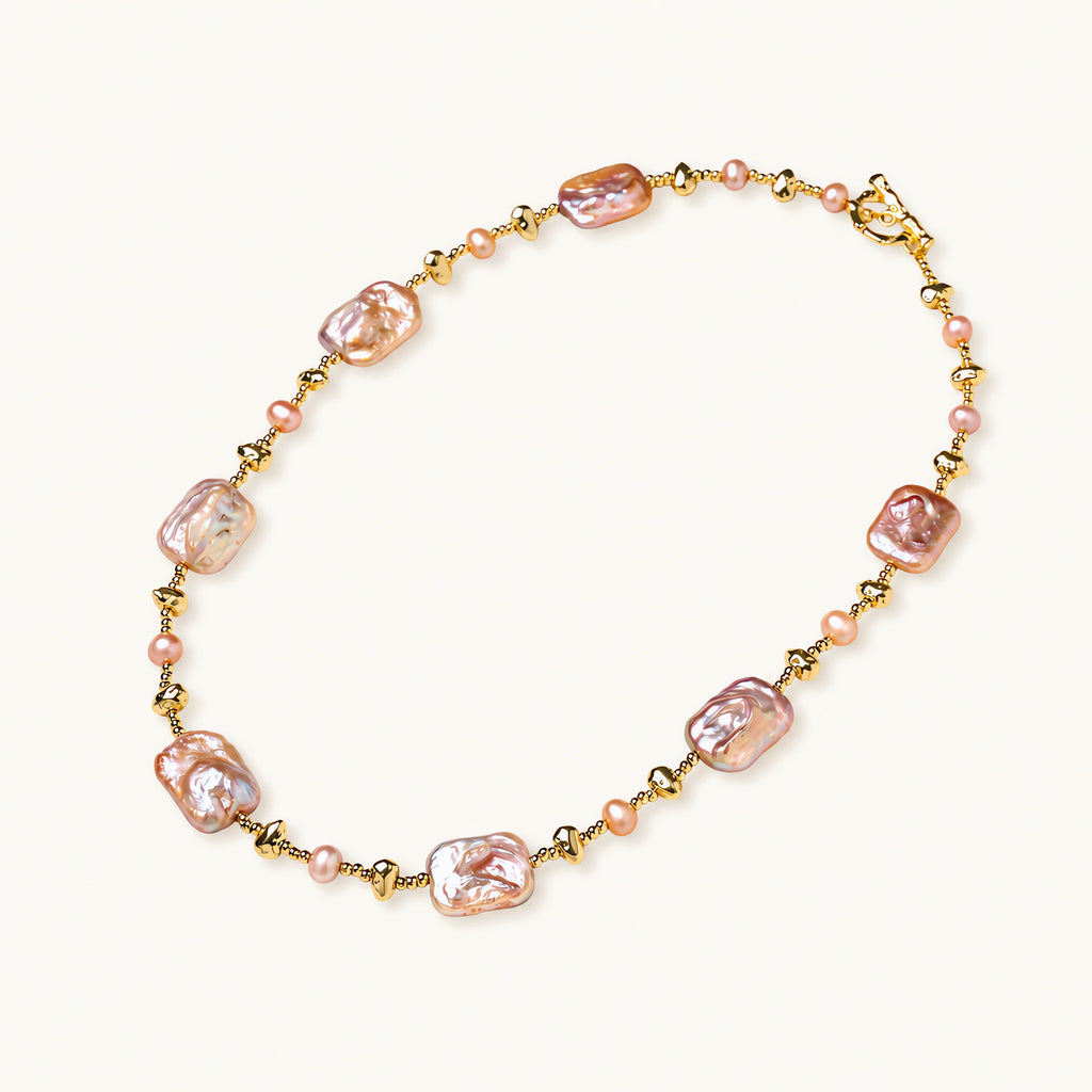 Iridescent baroque pearls alternating with small freshwater pearls on 14K gold-plated chain